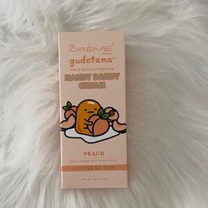 the Crème Shop Gudetama Peach Hand Cream - Peach Scented Hydration